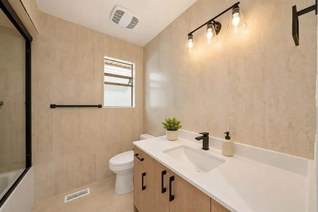 Renovated bathroom in White Rock with modern tile and fixtures
