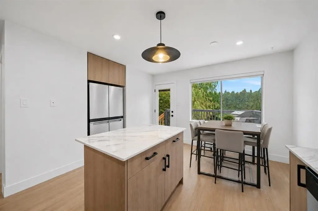 Renovated kitchen with new cabinets and island in White Rock BC